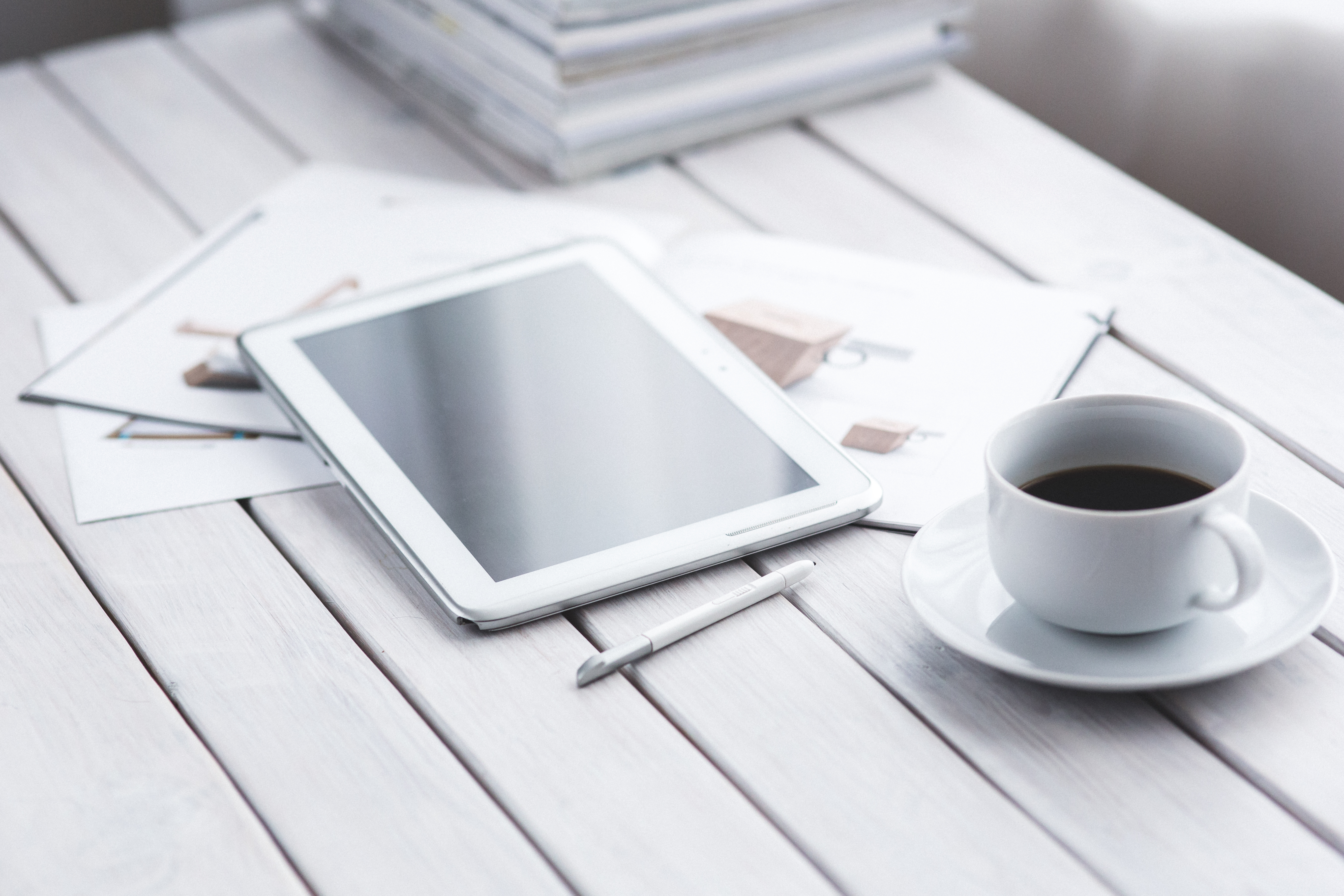 Canva - White tablet and cup of coffee