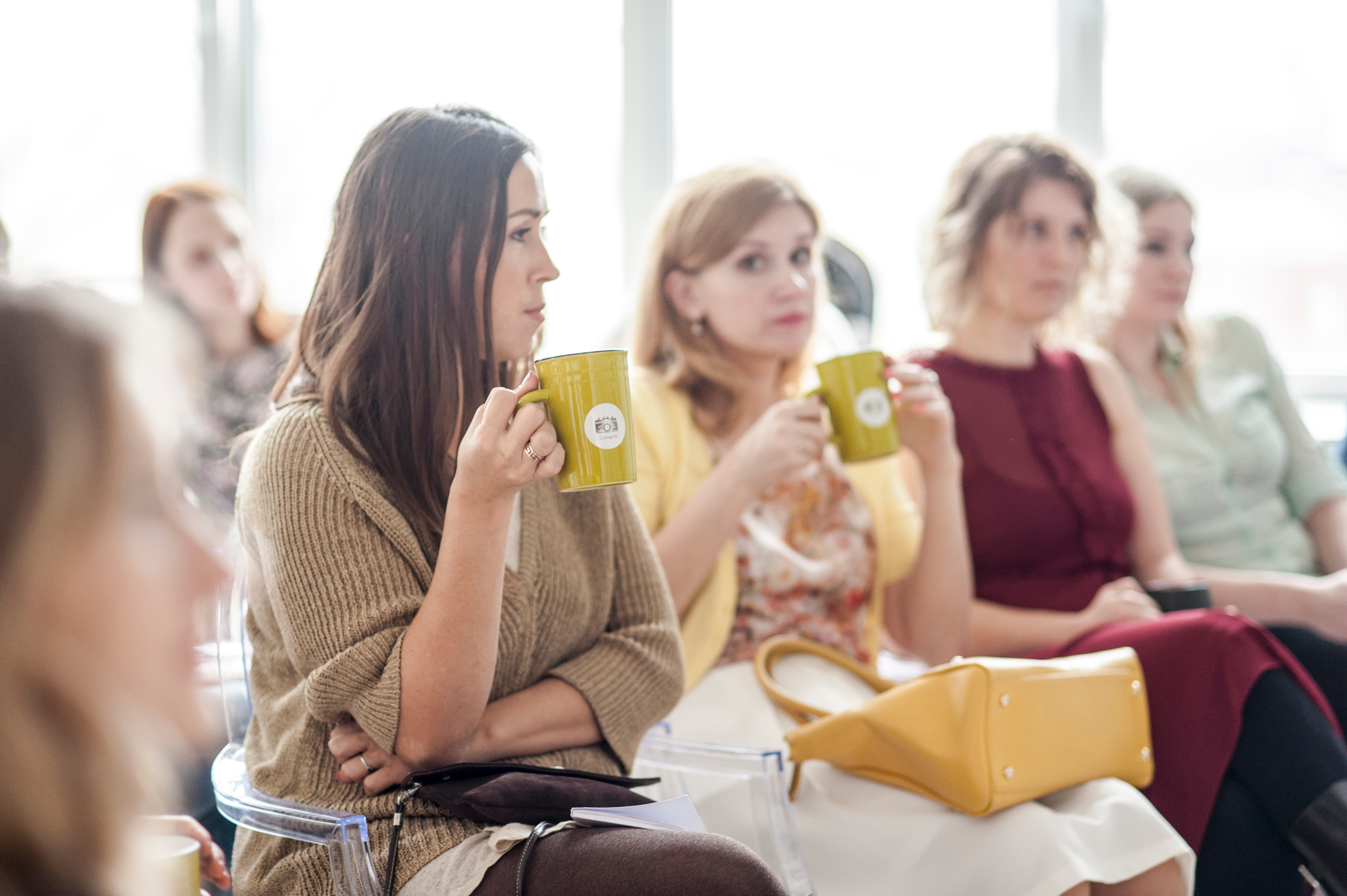 Canva - Woman Wearing Brown Corduroy Coat Holding Mug While Sitting on Chair