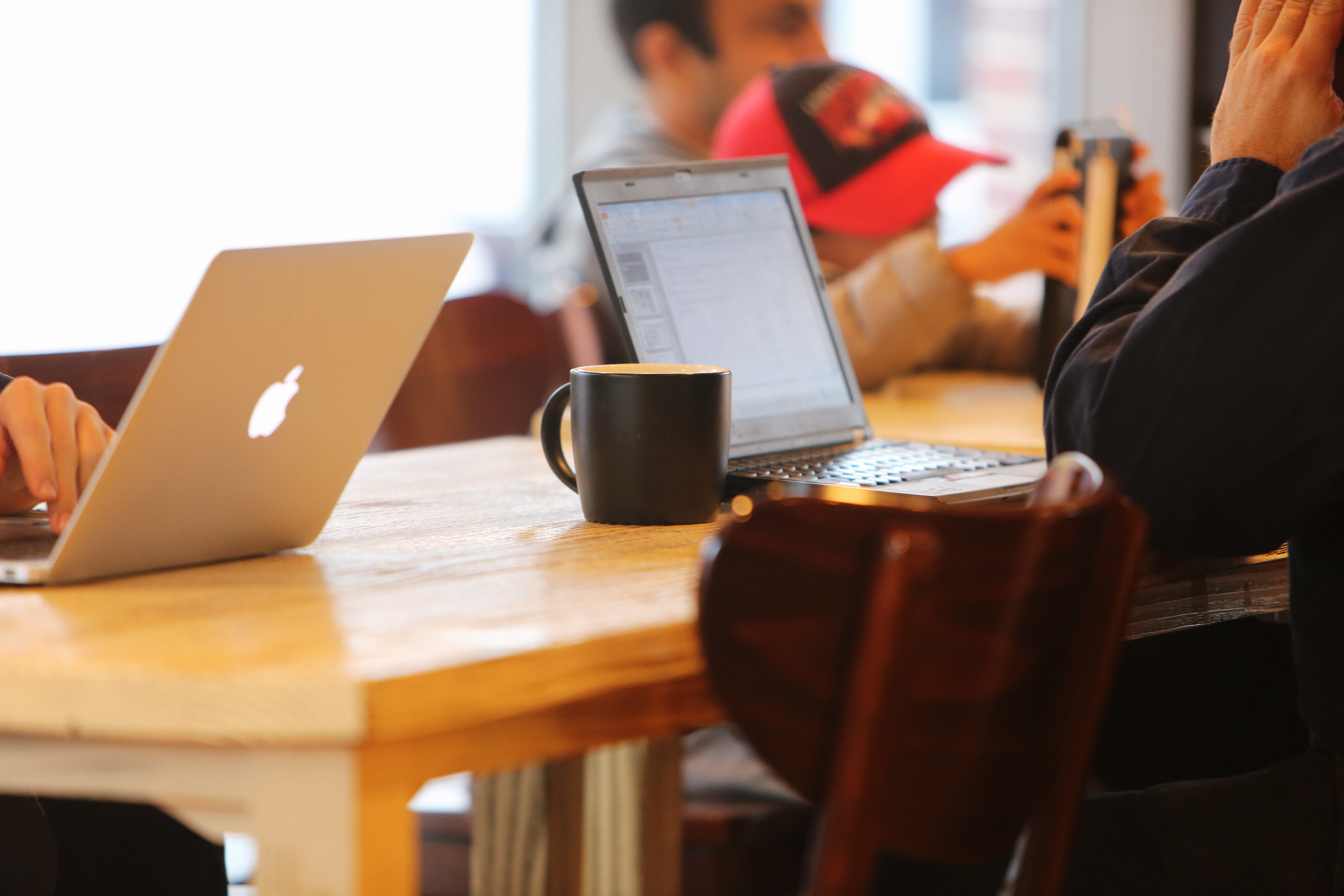 Canva - People Using Laptops While Sitting on Chair