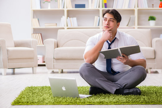 Businessman sitting on the floor in office